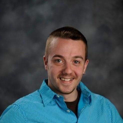 A younger Travis Jack Stevens smiling in a portrait